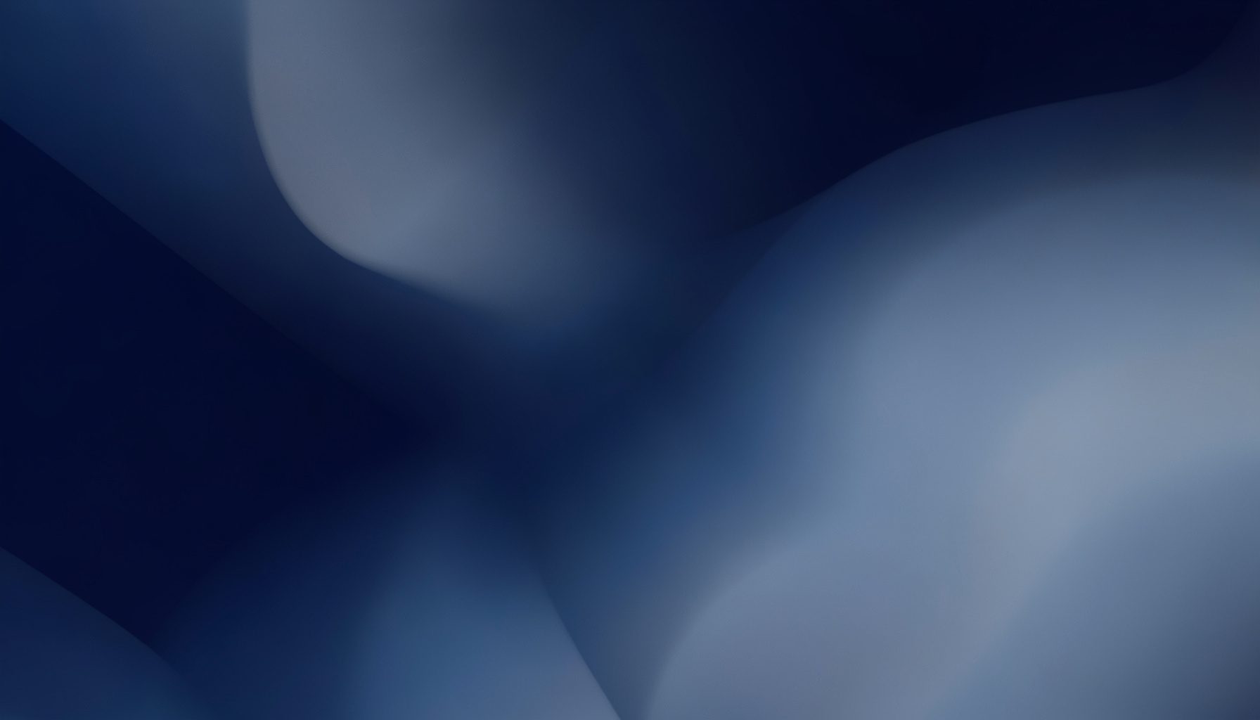 Abstract composition of deep indigo and muted silver tones blending softly, evoking a sleek tech atmosphere