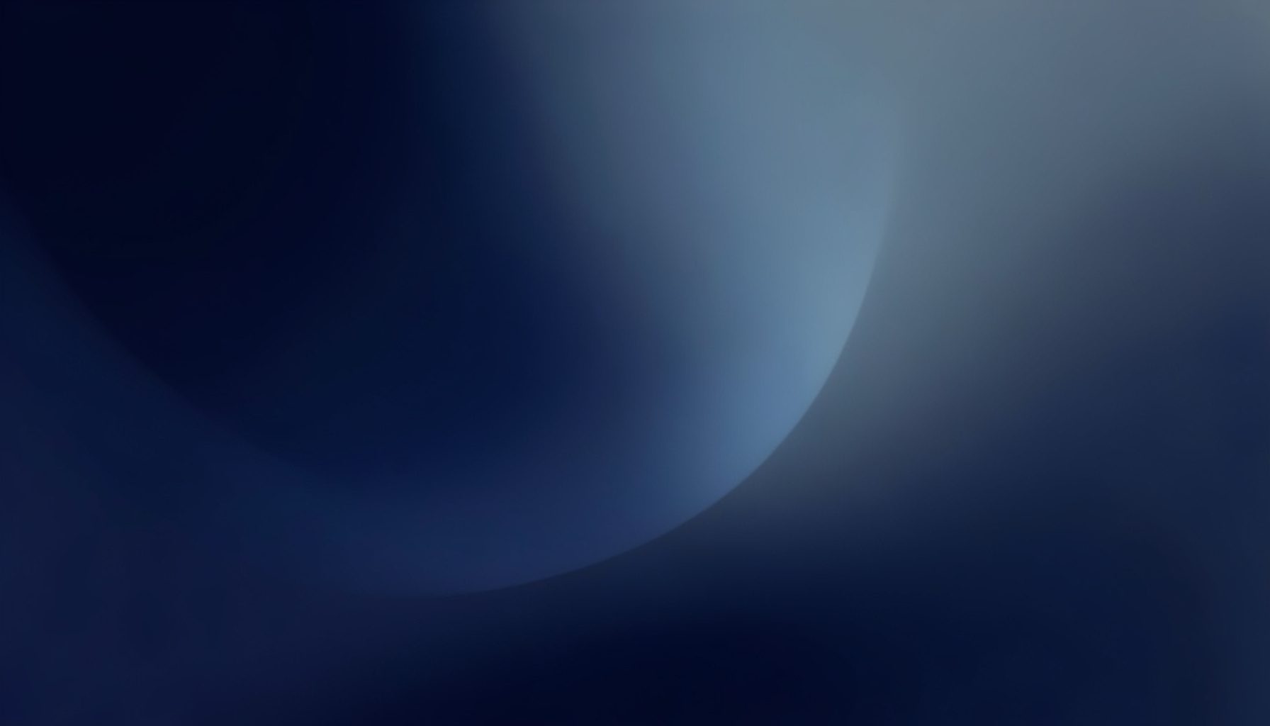 Abstract gradient composition in deep navy and muted steel blue tones, with soft atmospheric transitions